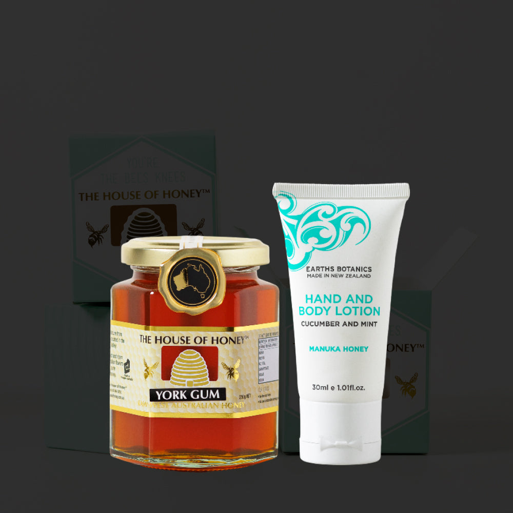 Jar of honey and tube of hand and body lotion on a dark background
