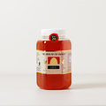 Jar of honey from 'The House of Honey' on a white background